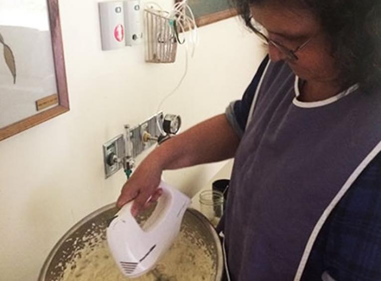 Woman preparing soapberry ice cream.