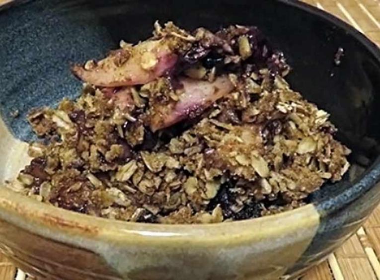 Fruit crisp in a bowl.
