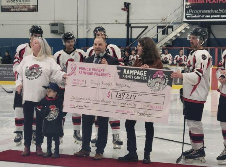 Jesse Sales, Health Services Administrator, Prince Rupert and Haida Gwaii, members of the Rampage at the cheque presentation
