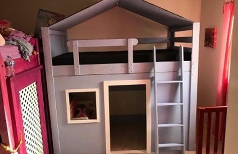 Small playhouse made out of wood.